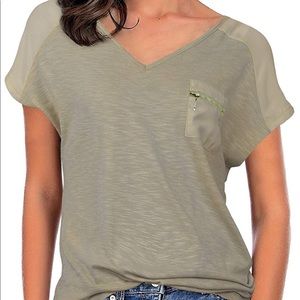 New. Women’s pocket zip tee